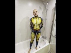 Sexy boy having a hot shower rubbing off body paint