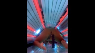 Thick Milf Takes Her BBC Dildo To The Tanning Salon And Squirts All Over The Sunbed