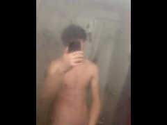 Cute teen jerks off before shower