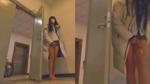 Chinese ladyboy ejaculates in the corridor while listening to the sound of the elevator