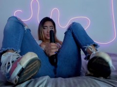 Sexy blonde having an amazing orgasm with her vibrator and squirting in her blue jeans