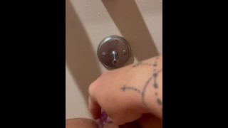 Water pounding on my clit while I fuck my dildo in the tub