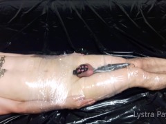 The mistress wraps the slave in plastic wrap and tortures him with vibrations on his full testicles