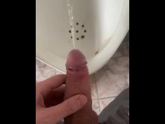 A guy pees in an office public toilet with his beautiful dick with big balls