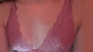 Teasing girl in pink bra and black panty