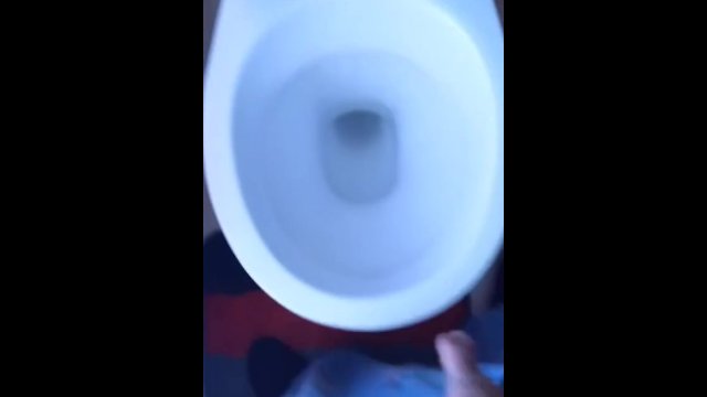 Pees into toilet