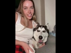 Sexy blondie plays with her dog