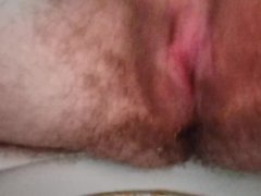Masturbating and squirting closeup view