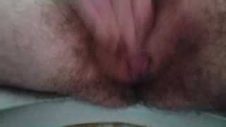 Masturbating and squirting closeup view