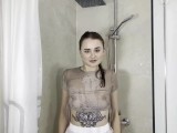 Hot crazy woman watering herself in the shower with her clothes on