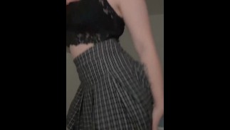 милашка вертит своей попкой в мини юбке