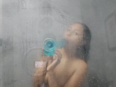 vShowering in the hotel bathroom and masturbation with the dildo