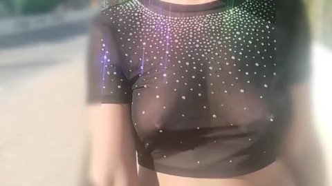 flashing her tits while walking around the city in public