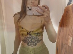 Babe tries on new outfits and shows off her hard nipples in public