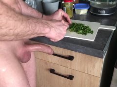 guy jerks off his dick while preparing breakfast