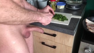 guy jerks off his dick while preparing breakfast