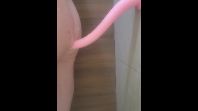 Fucking my transgender ass in the shower with my bigass two foot pink dildo. I take it all.