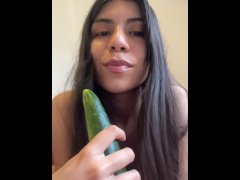 Sucking a cucumber