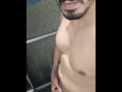 Smiling and masturbating in the shower