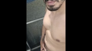Smiling and masturbating in the shower