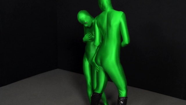 Two hot Zentai girls in different spandex colors playing with bondage ropes