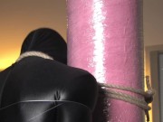 Preview 6 of Spandex zentai babe with fishing line tied to concrete post