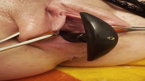 Birthing inflatable plug from spread out pussy - closeup