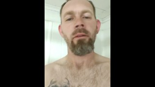 Stroking hard cock in shower