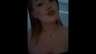 Pretty girl squeezes her tits.