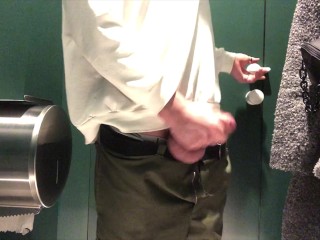 young athletic guy jerks off big dick in a public toilet
