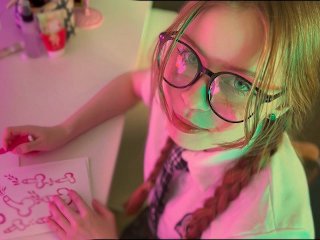 Screen Capture of Video Titled: Schoolgirl with glasses drew penises instead of homework and was fucked on the table
