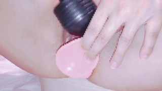 Japanese perverted shaved slut masturbates with a dildo.