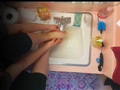18 year old washing feet in sink