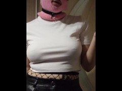 smoking girl in a pink balaclava and a cat mask
