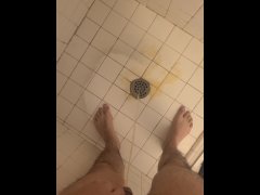 Boy pissing in the shower