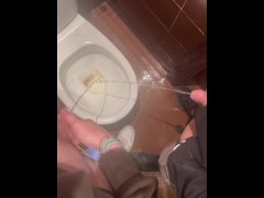 Two straight guys pee together at bar