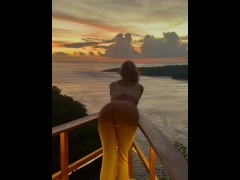 Bending over watching the sunset