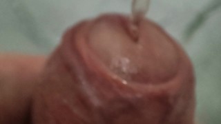 Close up piss on uncut cock