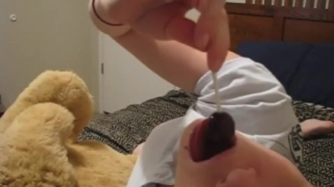 Sexy solo teen half naked sucking on a lollipop