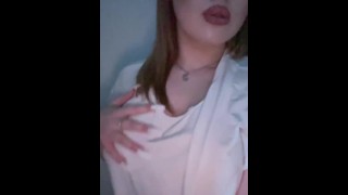Hot girl squeezing her tits.