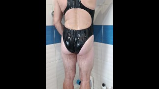 Boy wearing sexy realise Black swimsuit and get shower