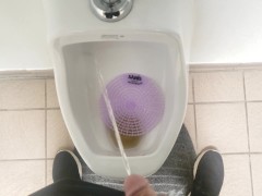 Pissing in a urinal