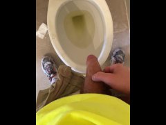 Construction worker pissing in the toilet