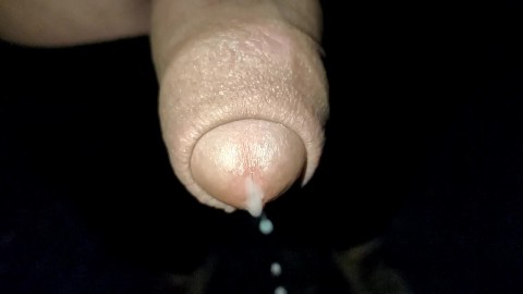 Close up slow motion - Cum dripping out of uncut cock