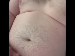 Hairy chub boy jerks off onto big belly