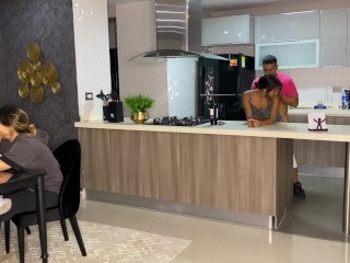 Aisha Fucks her Friend in the Kitchen while her Family is at the Table