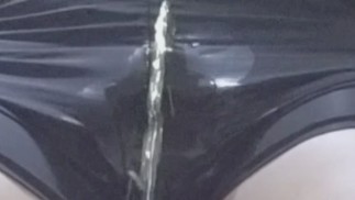Video of a man leaking a large amount of urine while wearing spats
