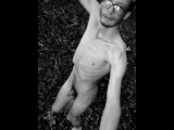 Slender man running around the forest completely naked black and white video