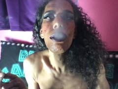 sexy trans getting horny while smoking a cigarette .
