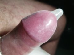 Slow motion and close up of my dick in condom being vibrated in slow motion